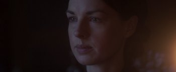 Movie still from “Carmilla” (2019), directed by Emily Harris – A woman's face in the dark; Close Up shot, Over the shoulder angle