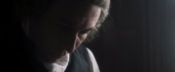 Movie still from “Carmilla” (2019), directed by Emily Harris – A person's face in the dark; Close Up shot, Over the shoulder angle