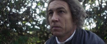 Movie still from “Carmilla” (2019), directed by Emily Harris – A person wearing a black shirt; Close Up shot, Low angle