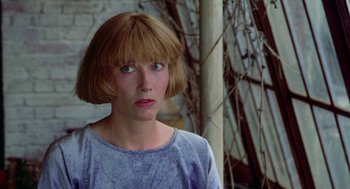 Movie still from “Carrington” (1995), directed by Christopher Hampton – A person with short brown hair; Close Up shot, Low angle