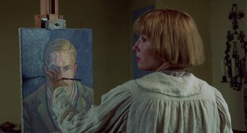 Movie still from “Carrington” (1995), directed by Christopher Hampton – A woman is painting a picture of a man; Close Up shot, Over the shoulder angle