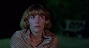 Movie still from “Carrington” (1995), directed by Christopher Hampton – A woman with short brown hair and bangs looking sad; Close Up shot, Low angle