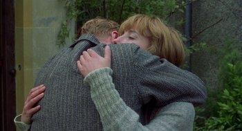 Movie still from “Carrington” (1995), directed by Christopher Hampton – A man and a woman hugging each other outside; Close Up shot, Over the shoulder angle