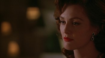 Movie still from “Cast a Deadly Spell” (1991), directed by Martin Campbell – A person wearing a red lipstick; Close Up shot, Over the shoulder angle