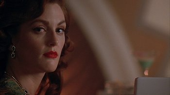 Movie still from “Cast a Deadly Spell” (1991), directed by Martin Campbell – A person with red lipstick; Close Up shot, Over the shoulder angle