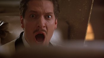 Movie still from “Cast a Deadly Spell” (1991), directed by Martin Campbell – A person with a mouth open; Close Up shot, Low angle