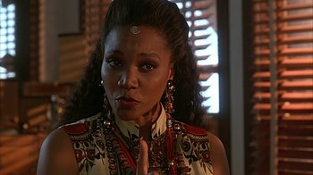 Movie still from “Cast a Deadly Spell” (1991), directed by Martin Campbell – A person with long hair; Close Up shot, Over the shoulder angle