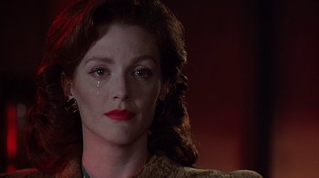 Movie still from “Cast a Deadly Spell” (1991), directed by Martin Campbell – A person with her eyes closed; Close Up shot, Low angle