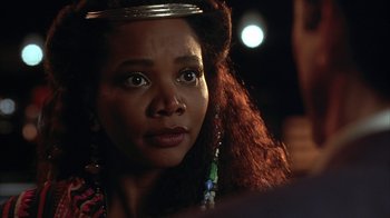 Movie still from “Cast a Deadly Spell” (1991), directed by Martin Campbell – A person wearing a crown; Close Up shot, Over the shoulder angle