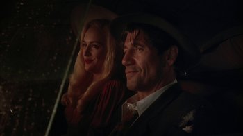 Movie still from “Cast a Deadly Spell” (1991), directed by Martin Campbell – A man and a woman sitting next to each other in a car; Close Up shot, Over the shoulder angle