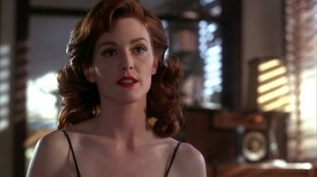 Movie still from “Cast a Deadly Spell” (1991), directed by Martin Campbell – A person with long hair; Close Up shot, Low angle