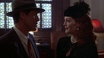 Movie still from “Cast a Deadly Spell” (1991), directed by Martin Campbell – A man and a woman talking to each other; Close Up shot, Over the shoulder angle