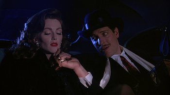 Movie still from “Cast a Deadly Spell” (1991), directed by Martin Campbell – A man and a woman in a car; Close Up shot, Low angle