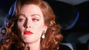 Movie still from “Cast a Deadly Spell” (1991), directed by Martin Campbell – A person with red hair; Close Up shot, Over the shoulder angle