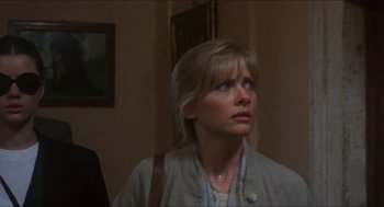 Movie still from “Castle Freak” (1995), directed by Stuart Gordon – A woman looking up at the ceiling of a room; Close Up shot, Low angle