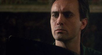 Movie still from “Castle Freak” (1995), directed by Stuart Gordon – A person looking at the camera; Close Up shot, Low angle