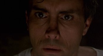 Movie still from “Castle Freak” (1995), directed by Stuart Gordon – A person's eyes looking at the camera; Extreme Close Up shot, Low angle