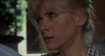 Movie still from “Castle Freak” (1995), directed by Stuart Gordon – A person with blue eyes; Close Up shot, Low angle