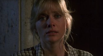 Movie still from “Castle Freak” (1995), directed by Stuart Gordon – A person with a crying face; Close Up shot, Low angle