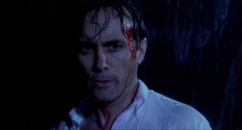 Movie still from “Castle Freak” (1995), directed by Stuart Gordon – A person with blood on his face; Close Up shot, Low angle