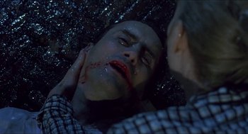 Movie still from “Castle Freak” (1995), directed by Stuart Gordon – A man with blood all over his face and neck; Close Up shot, Overhead angle