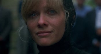 Movie still from “Castle Freak” (1995), directed by Stuart Gordon – A person wearing a black jacket; Close Up shot, Low angle