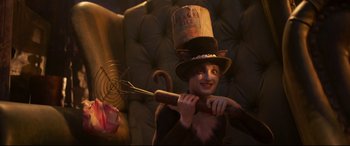 Movie still from “Cats” (2019), directed by Tom Hooper – A child in a top hat holding a baseball bat; Medium shot, High angle