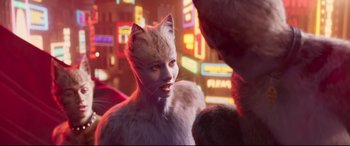Movie still from “Cats” (2019), directed by Tom Hooper – A woman in a cat costume standing next to another woman; Close Up shot, Over the shoulder angle