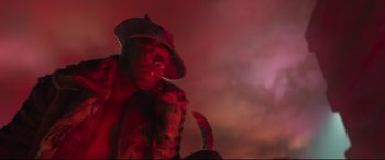 Movie still from “Cats” (2019), directed by Tom Hooper – A man in a hat is standing in the dark; Close Up shot, Low angle