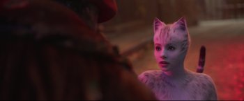 Movie still from “Cats” (2019), directed by Tom Hooper – A woman in a cat costume looking into the camera; Close Up shot, Over the shoulder angle