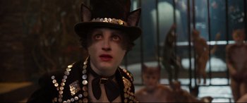 Movie still from “Cats” (2019), directed by Tom Hooper – A person wearing a top hat; Close Up shot, Over the shoulder angle