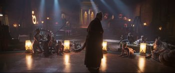 Movie still from “Cats” (2019), directed by Tom Hooper – A man is standing in the middle of a stage; Wide shot, High angle