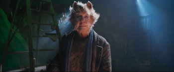 Movie still from “Cats” (2019), directed by Tom Hooper – A man with a cat's face and a beard; Close Up shot, Low angle