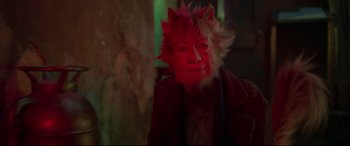 Movie still from “Cats” (2019), directed by Tom Hooper – A person with a cat mask on; Close Up shot, High angle