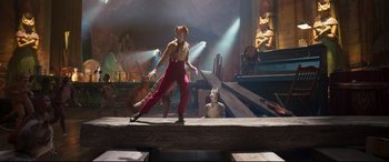 Movie still from “Cats” (2019), directed by Tom Hooper – A man dressed as a cat on a stage; Wide shot, Low angle