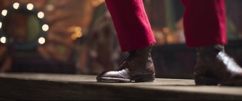 Movie still from “Cats” (2019), directed by Tom Hooper – A person's foot wearing a brown shoe; Extreme Close Up shot, Low angle