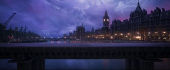 Movie still from “Cats” (2019), directed by Tom Hooper – A view of a city at night with a large clock tower; Extreme Wide shot, High angle