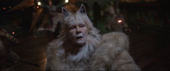Movie still from “Cats” (2019), directed by Tom Hooper – A woman in a cat costume is looking at the camera; Close Up shot, Over the shoulder angle
