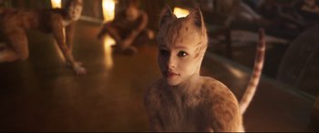 Movie still from “Cats” (2019), directed by Tom Hooper – A woman with a cat's face on the floor; Close Up shot, High angle