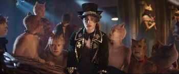 Movie still from “Cats” (2019), directed by Tom Hooper – A group of people dressed up as cats; Medium shot, Over the shoulder angle