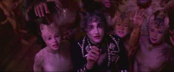 Movie still from “Cats” (2019), directed by Tom Hooper – A group of people dressed up as cats; Close Up shot, High angle