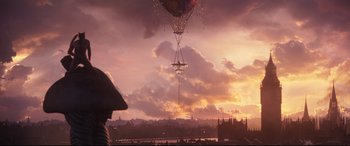 Movie still from “Cats” (2019), directed by Tom Hooper – An air balloon is flying in the sky at sunset; Extreme Wide shot, Low angle