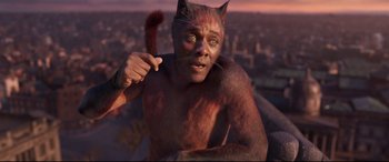 Movie still from “Cats” (2019), directed by Tom Hooper – A man with a cat on his shoulder; Close Up shot, Overhead angle