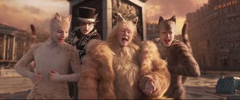 Movie still from “Cats” (2019), directed by Tom Hooper – A group of people dressed up as cats; Medium shot, High angle