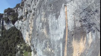 Movie still from “Cave of Forgotten Dreams” (2010), directed by Werner Herzog – The side of a rock wall; Extreme Wide shot, Overhead angle