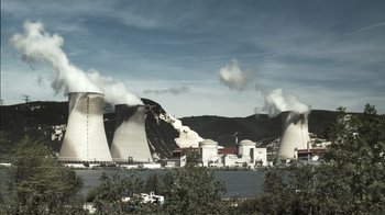 Movie still from “Cave of Forgotten Dreams” (2010), directed by Werner Herzog – A view of a power plant from across the river; Extreme Wide shot, Low angle