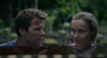 A man and a woman looking at one another