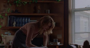 Movie still from “Certain Women” (2016), directed by Kelly Reichardt – A woman is writing on a piece of paper; Medium shot, Over the shoulder angle