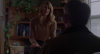 Movie still from “Certain Women” (2016), directed by Kelly Reichardt – A woman standing in front of a man in a room; Medium shot, Over the shoulder angle