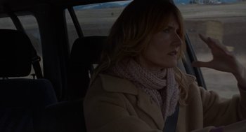 Movie still from “Certain Women” (2016), directed by Kelly Reichardt – A woman sitting in the passenger seat of a car; Close Up shot, Over the shoulder angle